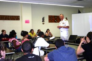 u337-US_Navy_060612-N-8110K-034_Deputy_Commander_Ship_Design_Integration_and_Engineering_Naval_Sea_Systems_Command_Rear_Adm._Kevin_McCoy_talks_to_Navy_and_Marine_Corps_Junior_ROTC_students