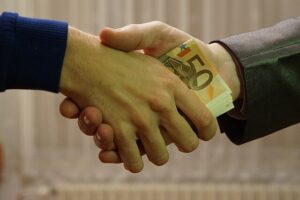 u338-10_-_hands_shaking_with_euro_bank_notes_inside_handshake_-_royalty_free_without_copyright_public_domain_photo_image_01