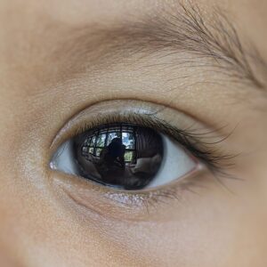 u338-Close-up_photograph_of_the_eye_of_a_baby_with_reflection_of_the_scene_in_the_pupil